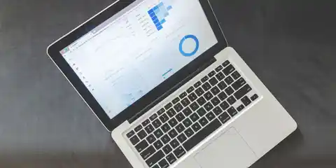 Overhead view of a laptop showing charts and data visualizations