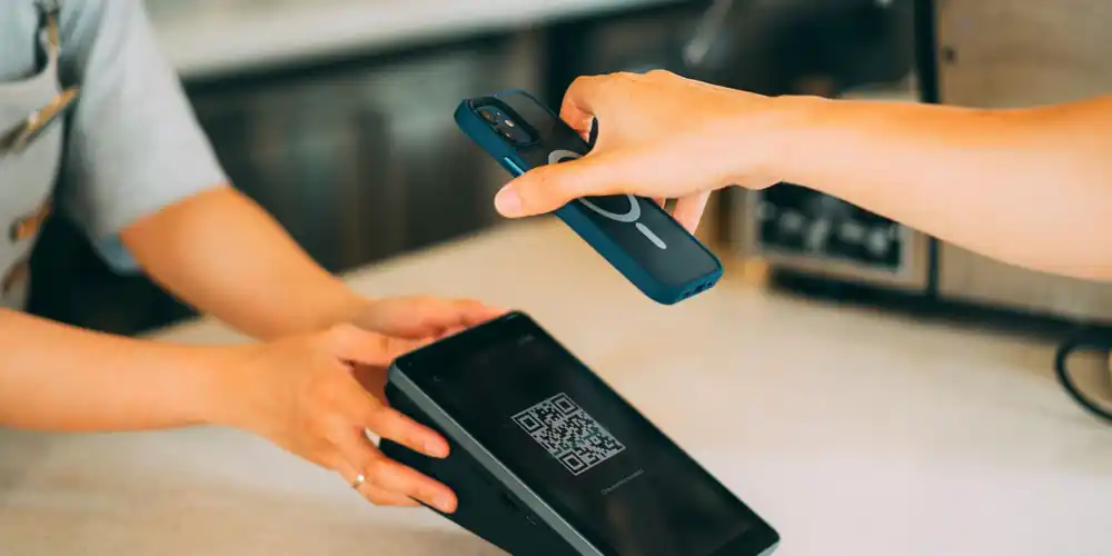 Phone being scanned at a check-in point