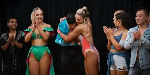 Dance team celebrating results at a competition